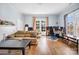 Cozy living room with hardwood floors, lots of light, and ample space for relaxing and entertaining at 121 York St, Chester, SC 29706
