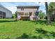 Large, grassy backyard with a wooden deck, perfect for outdoor relaxation and entertaining at 1218 Faversham Ln, Rock Hill, SC 29730