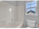 Bathroom with white tub/shower combo and toilet at 1218 Faversham Ln, Rock Hill, SC 29730