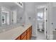 Bathroom with wooden vanity and view into toilet room at 1218 Faversham Ln, Rock Hill, SC 29730
