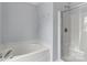 Bathroom with a soaking tub, glass door shower, and neutral wall color at 1218 Faversham Ln, Rock Hill, SC 29730