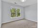 Bedroom with neutral carpet and natural light from a large window at 1218 Faversham Ln, Rock Hill, SC 29730