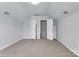 Spacious bedroom featuring neutral carpet, white walls, and multiple closets at 1218 Faversham Ln, Rock Hill, SC 29730