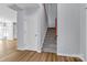 Bright entryway with wood floors, staircase, and white front door at 1218 Faversham Ln, Rock Hill, SC 29730
