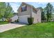Two-story home showcasing a well-kept lawn and a two-car garage at 1218 Faversham Ln, Rock Hill, SC 29730