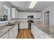 Kitchen features granite countertops, white cabinets, and stainless steel appliances at 1218 Faversham Ln, Rock Hill, SC 29730