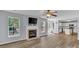 Open-concept living area with fireplace, TV mount, and door leading to the outdoor deck at 1218 Faversham Ln, Rock Hill, SC 29730