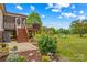 Spacious backyard featuring a deck, a swing set and well-maintained landscaping at 1260 Summer Ln, Salisbury, NC 28146