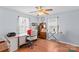 Comfortable bedroom featuring a desk and an ironing board at 1260 Summer Ln, Salisbury, NC 28146
