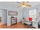 Comfortable bedroom featuring a desk, a ceiling fan, and natural light at 1260 Summer Ln, Salisbury, NC 28146