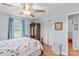 Bright bedroom with hardwood floors, ceiling fan, and a window providing natural light at 1260 Summer Ln, Salisbury, NC 28146