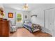 Bright bedroom with a charming armchair and ample natural light from the window at 1260 Summer Ln, Salisbury, NC 28146