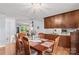Dining area featuring wood table, seating for six, and an adjacent kitchen, great for entertaining at 1260 Summer Ln, Salisbury, NC 28146