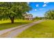 Charming two-story home with a long driveway, an attached garage and a sprawling front yard at 1260 Summer Ln, Salisbury, NC 28146