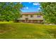Classic home with a well-maintained lawn, beautiful landscaping, and inviting facade at 1260 Summer Ln, Salisbury, NC 28146