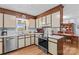 Bright kitchen featuring updated appliances, white countertops, and convenient access to the dining area at 1260 Summer Ln, Salisbury, NC 28146