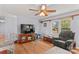 Comfortable living room with hardwood floors, ceiling fan, and a large window providing natural light at 1260 Summer Ln, Salisbury, NC 28146