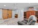 Bright living room boasts hardwood cabinets, a ceiling fan and wooden sliding doors at 1260 Summer Ln, Salisbury, NC 28146