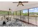 Relaxing screened-in porch featuring a ceiling fan, lattice trim and comfortable rocking chairs at 1260 Summer Ln, Salisbury, NC 28146
