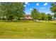 Sprawling front yard and mature trees create a serene and private setting at 1260 Summer Ln, Salisbury, NC 28146