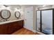 Double sink bathroom with granite counters and enclosed glass shower at 174 Buffalo Creek Dr, Statesville, NC 28677
