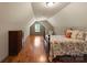 Bright bedroom featuring hardwood floors and a window at 174 Buffalo Creek Dr, Statesville, NC 28677