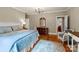 Bedroom features a white headboard, wood floors, and soft blue accents at 174 Buffalo Creek Dr, Statesville, NC 28677