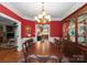 Formal dining room with elegant chandelier and wood table at 174 Buffalo Creek Dr, Statesville, NC 28677