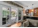 View from living room through screened porch to a kitchen with stainless appliances at 174 Buffalo Creek Dr, Statesville, NC 28677