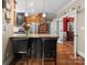 Gourmet kitchen island boasts a breakfast bar and stone countertops at 174 Buffalo Creek Dr, Statesville, NC 28677