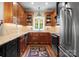 Well-equipped kitchen showcases custom cabinetry and stainless steel appliances at 174 Buffalo Creek Dr, Statesville, NC 28677