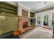 Comfortable living room with fireplace and view to backyard at 174 Buffalo Creek Dr, Statesville, NC 28677