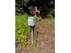Close-up of a vintage water spigot and electrical box in the yard at 174 Buffalo Creek Dr, Statesville, NC 28677