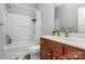 Bathroom with tub and shower and wooden vanity at 18020 Owl Ct, Indian Land, SC 29707