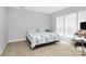 Bright bedroom with a coastal themed bedspread and a sunlit window at 18020 Owl Ct, Indian Land, SC 29707