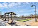 Outdoor bocce ball courts with shaded benches and well-maintained landscaping at 18020 Owl Ct, Indian Land, SC 29707