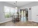 Bright breakfast nook featuring tile floors, large windows, and sliding glass doors to the patio at 18020 Owl Ct, Indian Land, SC 29707