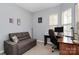 Comfortable office space with a sleeper sofa and a desk area by the window at 18020 Owl Ct, Indian Land, SC 29707