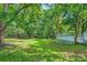 Lush backyard with grass and a view of the deck at 200 Kimrod Ln, Charlotte, NC 28270