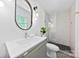 Contemporary bathroom with a floating vanity, glass-enclosed shower, and modern fixtures at 200 Kimrod Ln, Charlotte, NC 28270