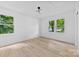 Bright bedroom with wood-look floors and double windows offering a lovely outdoor view at 200 Kimrod Ln, Charlotte, NC 28270