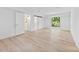 Spacious room featuring wood-look flooring and a door to a deck at 200 Kimrod Ln, Charlotte, NC 28270