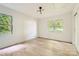 Cozy bedroom with two bright windows, wood floors, and simple decor at 200 Kimrod Ln, Charlotte, NC 28270