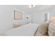 Bright bedroom with hardwood floors, neutral colored bedding, and access to a walk-in closet at 200 Kimrod Ln, Charlotte, NC 28270