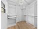 Walk-in closet with custom shelving and wood-look flooring, offering ample storage space at 200 Kimrod Ln, Charlotte, NC 28270