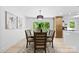 Bright dining room with a wood table with seating for six and large sliding glass doors to the deck at 200 Kimrod Ln, Charlotte, NC 28270