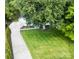 Aerial view of a house with expansive lawn, mature trees, and a long driveway at 200 Kimrod Ln, Charlotte, NC 28270