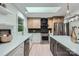 Modern kitchen features two-tone cabinets, chevron backsplash, stainless steel appliances, and a bright skylight at 200 Kimrod Ln, Charlotte, NC 28270