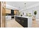 Modern kitchen with a large island, stainless steel appliances, black accents, and open layout at 200 Kimrod Ln, Charlotte, NC 28270