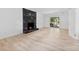 Living room featuring a modern fireplace with marble surround and hardwood floors at 200 Kimrod Ln, Charlotte, NC 28270